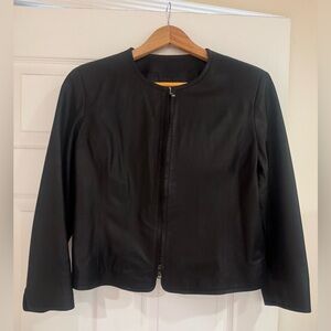 Cropped black genuine leather jacket. Purchased in Florence. In new condition